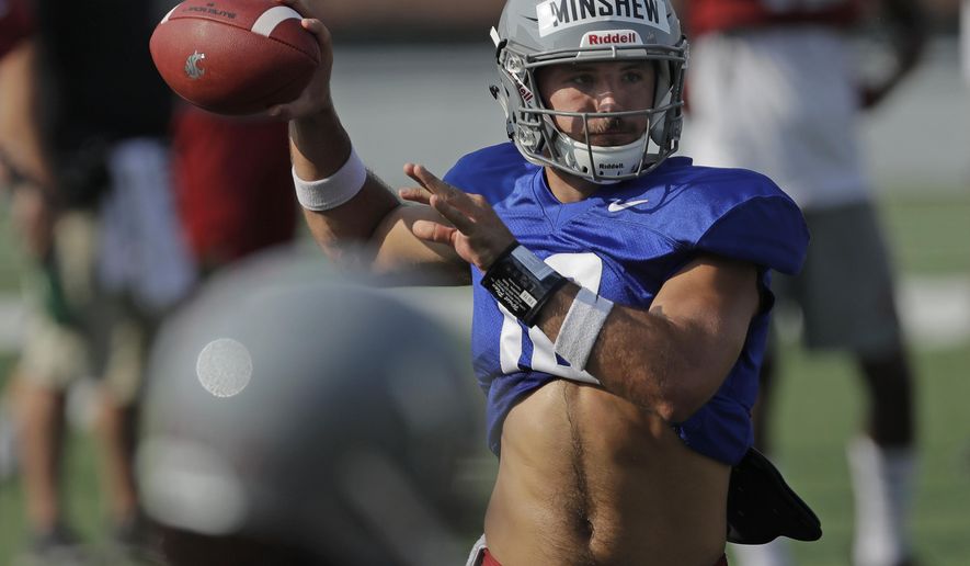 Washington State quarterback Gardner Minshew passes during NCAA college football practice, Thursday, Aug. 16, 2018, in Pullman, Wash. Minshew is one of three quarterbacks competing for the starting job. (AP Photo/Ted S. Warren)