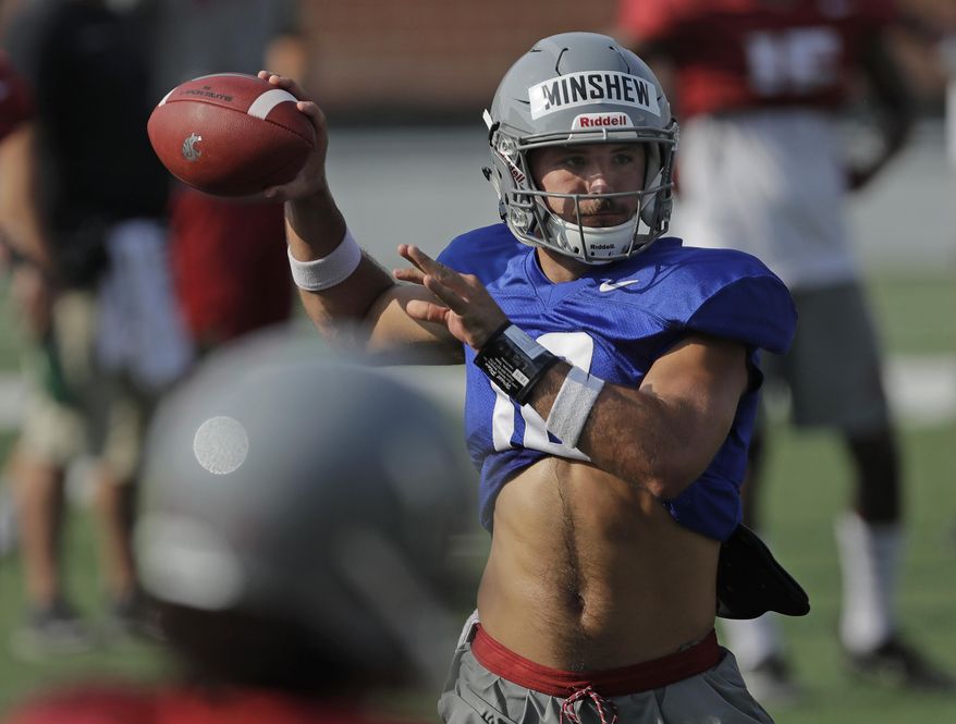 Washington State quarterback Gardner Minshew passes during NCAA college football practice, Thursday, Aug. 16, 2018, in Pullman, Wash. Minshew is one of three quarterbacks competing for the starting job. (AP Photo/Ted S. Warren)