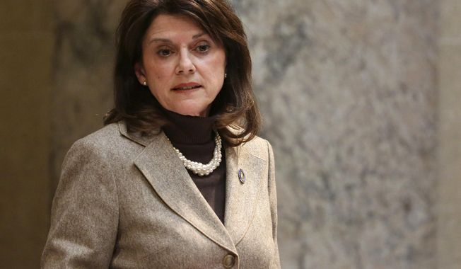 FILE - In this Nov. 7, 2017, file photo, Wisconsin state Sen. Leah Vukmir stands in the Senate chambers at the state Capitol in Madison. Vukmir, a Wisconsin state senator and close ally to Gov. Scott Walker, defeated a former Marine who cast himself as a political outsider to win the Republican primary for U.S. Senate on Tuesday, Aug. 14, 2018. (Michelle Stocker/The Capital Times via AP, File)