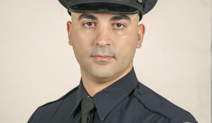 In an undated photo provided by the Detroit Police, Officer Fadi Shukur is shown. Flags will be lowered to half-staff Monday, Aug. 20, 2018 in honor of the police officer who died after being struck by a speeding SUV while assisting with crowd and traffic control at a neighborhood event. Michigan Gov. Rick Snyder ordered the lowering for U.S. and Michigan flags at state buildings and within the state Capitol complex in honor of Officer Shukur, who died Wednesday, Aug.15. (Detroit Police via AP)