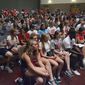 Supporters of New Mexico athletics attend the university Board of Regents meeting Friday, Aug. 17, 2018, in Albuquerque, N.M. (Jim Thompson/The Albuquerque Journal via AP)