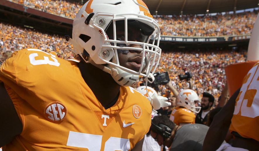 FILE - In this Oct. 14, 2017, file photo, Tennessee offensive lineman Trey Smith (73) makes his way onto the field for the Volunteers' game against South Carolina at Neyland Stadium in Knoxville, Tenn. Tennessee is counting on some reinforcements to help rebuild an offensive line that was devastated by injuries and defections last season. The Volunteers could use an immediate contribution from Alabama graduate transfer Brandon Kennedy, a successful comeback from Chance Hall and a full season from Trey Smith after he missed spring practice with blood clots in his lungs.(C.B. Schmelter/Chattanooga Times Free Press via AP, File)/Chattanooga Times Free Press via AP)