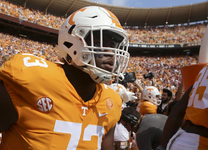FILE - In this Oct. 14, 2017, file photo, Tennessee offensive lineman Trey Smith (73) makes his way onto the field for the Volunteers' game against South Carolina at Neyland Stadium in Knoxville, Tenn. Tennessee is counting on some reinforcements to help rebuild an offensive line that was devastated by injuries and defections last season. The Volunteers could use an immediate contribution from Alabama graduate transfer Brandon Kennedy, a successful comeback from Chance Hall and a full season from Trey Smith after he missed spring practice with blood clots in his lungs.(C.B. Schmelter/Chattanooga Times Free Press via AP, File)/Chattanooga Times Free Press via AP)