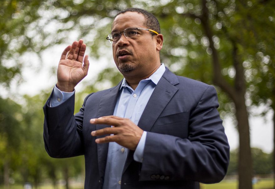 Rep. Keith Ellison addresses his campaign volunteers and supporters before sending them off on a door knocking campaign, Friday, Aug. 17, 2018, in Minneapolis. Minnesota Rep. Keith Ellison said Friday he won&#39;t abandon his campaign for attorney general amid allegations that he once physically abused an ex-girlfriend and said if she claims to have a video of the incident she should produce it. (Alex Kormann/Star Tribune via AP) ** FILE **