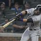 Colorado Rockies&#39; Gerardo Parra hits a line drive single to left field for an RBI against the Atlanta Braves during the ninth inning of a baseball game Saturday, Aug. 18, 2018, in Atlanta. (AP Photo/John Amis) ** FILE **