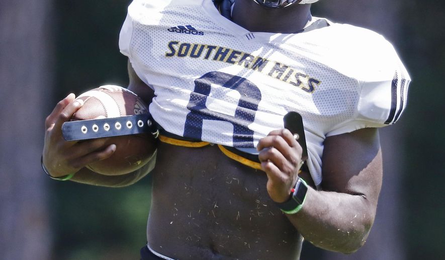 Southern Mississippi running back Tez Parks, carries the football upfield during NCAA college football practice at Southern Mississippi in Hattiesburg, Miss., Wednesday, Aug. 15, 2018. (AP Photo/Rogelio V. Solis