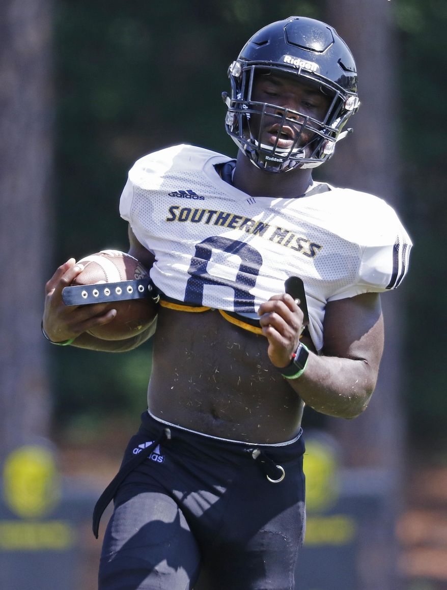 Southern Mississippi running back Tez Parks, carries the football upfield during NCAA college football practice at Southern Mississippi in Hattiesburg, Miss., Wednesday, Aug. 15, 2018. (AP Photo/Rogelio V. Solis