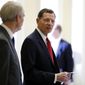 FILE - In this March 20, 2018 file photo, Sen. John Barrasso, R-Wyo., right speaks with Sen. Rob Portman, R-Ohio, after a Republican policy luncheon on Capitol Hill in Washington.  Dave Dodson, a political newcomer and businessman little known in Wyoming, has made a bold Republican primary bid to tap anger over Barrasso’s corporate donations and Washington ties. (AP Photo/Jacquelyn Martin, file)