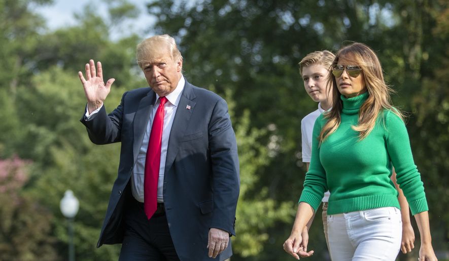 President Donald Trump, with first lady Melania Trump and their son Barron, arrives at the White House in Washington, Sunday, Aug. 19, 2018, after spending the weekend at his golf club in Bedminster, N.J. (AP Photo/J. Scott Applewhite)