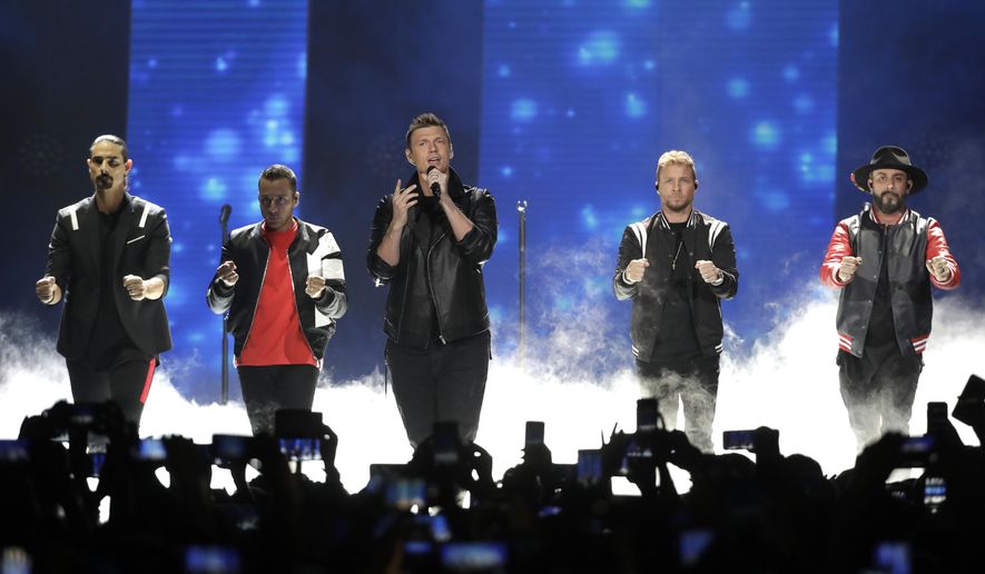 FILE - In this June 6, 2018 file photo, Kevin Richardson, Howie Dorough, Nick Carter, Brian Littrell, and AJ McLean of Backstreet Boys, perform "Don't go Breaking My Heart" at the CMT Music Awards at the Bridgestone Arena in Nashville, Tenn. Over a dozen people were injured, Saturday, Aug. 18 and transported to hospitals after trusses holding up the entrance to a resort where the Backstreet Boys were set to begin a concert in Oklahoma collapsed. (AP Photo/Mark Humphrey, File)