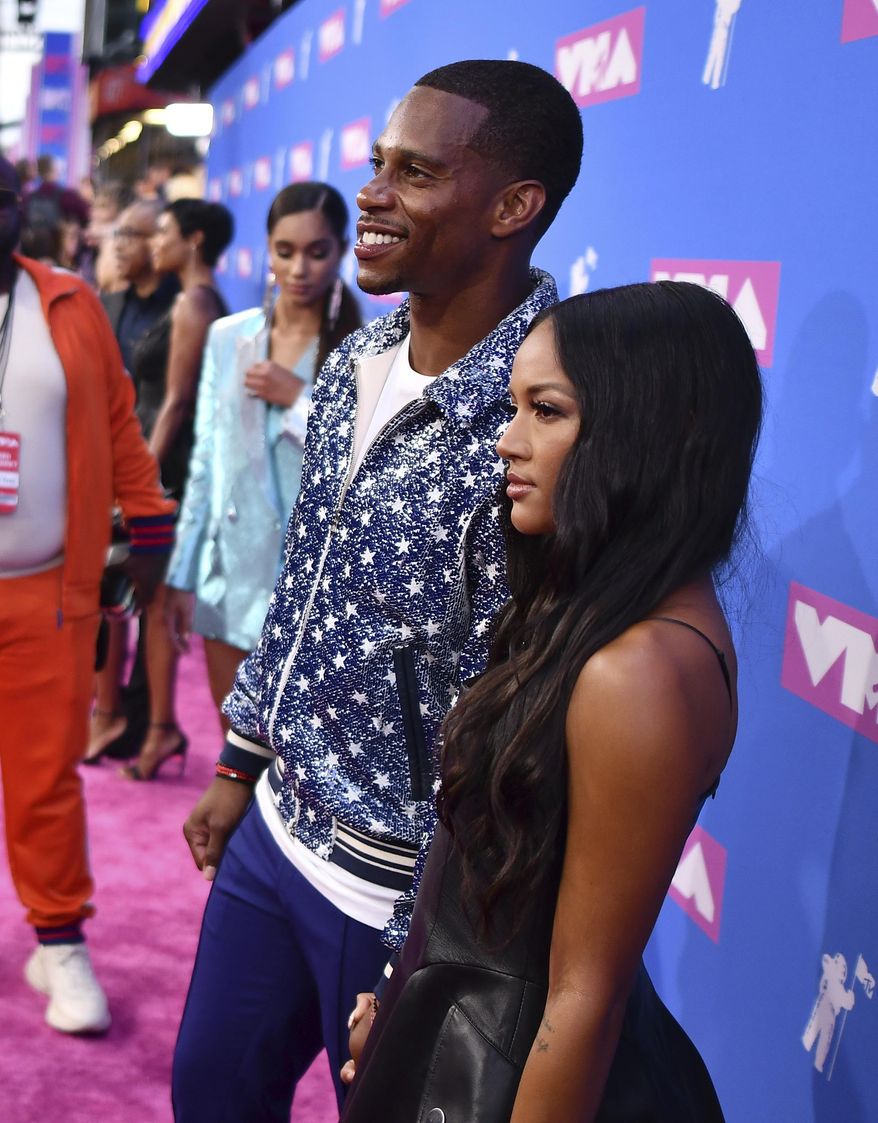 Victor Cruz, left, and Karrueche Tran arrive at the MTV Video Music Awards at Radio City Music Hall on Monday, Aug. 20, 2018, in New York. (Photo by Charles Sykes/Invision/AP)
