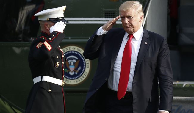 President Donald Trump salutes as he arrives on Marine One on the South Lawn of the White House in Washington, Wednesday, Aug. 30, 2017, as he returns from Springfield, Mo. (AP Photo/Carolyn Kaster)