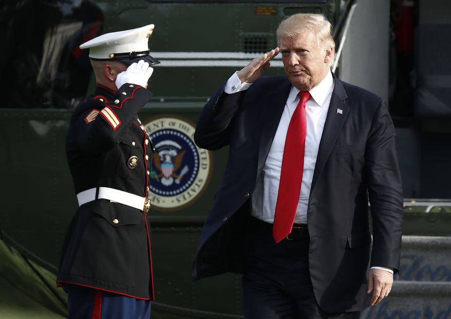 President Donald Trump salutes as he arrives on Marine One on the South Lawn of the White House in Washington, Wednesday, Aug. 30, 2017, as he returns from Springfield, Mo. (AP Photo/Carolyn Kaster)