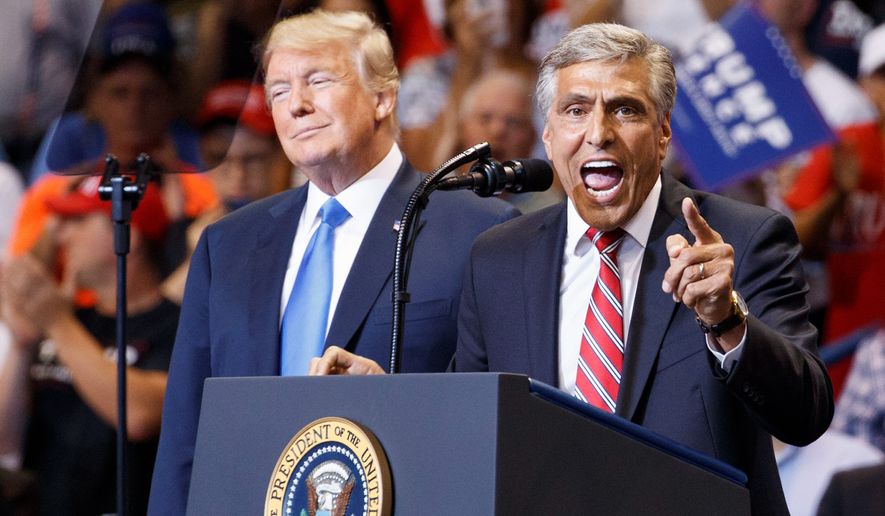 Republican Senate candidate Rep. Lou Barletta, R-Pa., speaks as President Donald Trump listens during a rally, Thursday, Aug. 2, 2018, at Mohegan Sun Arena at Casey Plaza in Wilkes Barre, Pa.. (AP Photo/Carolyn Kaster)