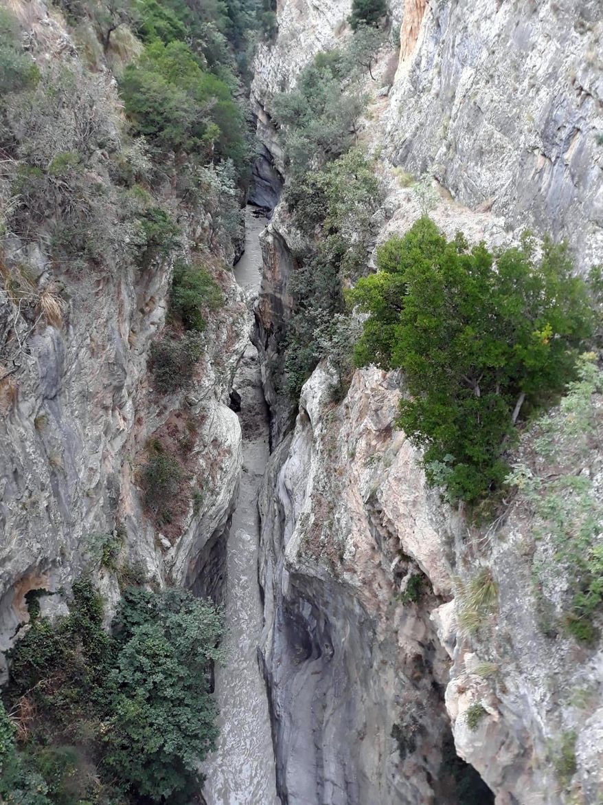 A view of the Raganello Gorge in Civita, Italy, Monday, Aug. 20, 2018. Italy’s civil protection agency says at least five people have been killed when a rain-swollen river flooded a gorge in the southern region of Calabria. The Italian news agency ANSA reported Monday that 12 people were brought to safety in the flash flood. It was unclear how many people were missing. The flood hit a group of hikers in the Raganello Gorge. (Antonio Iannicelli/ANSA via AP)