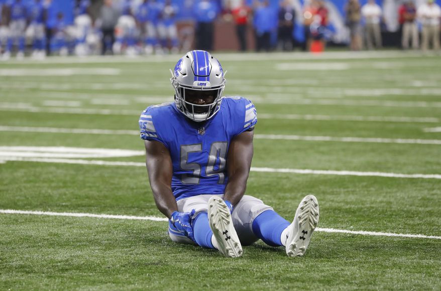 FILE - In this Aug. 17, 2018, file photo, Detroit Lions linebacker Steve Longa holds his leg after being injured during the second half of a preseason NFL football game against the New York Giants, in Detroit. Longa's knee injury represents a setback for a position group that already is potentially a problem area on Matt Patricia's defense. (AP Photo/Paul Sancya, File)