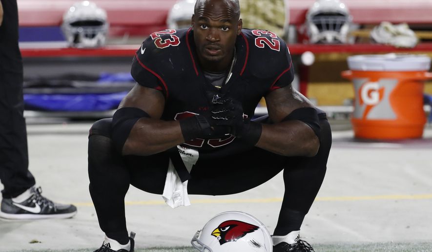 FILE - In this Nov. 9, 2017 file photo Arizona Cardinals running back Adrian Peterson (23) watches at the sideline during an NFL football game against the Seattle Seahawks in Glendale, Ariz. The Washington Redskins have signed Peterson. The team announced the deal Monday, Aug. 20, 2018 after meeting with him. (AP Photo/Rick Scuteri, file)