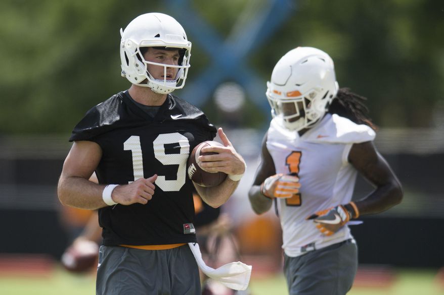 FILE - In this Aug. 3, 2018, file photo, Tennessee quarterback Keller Chryst (19) runs on the field during the first NCAA college football practice of the season in Knoxville, Tenn. Tennessee has added players from some of the nation's most successful programs in an attempt to jump-start the Volunteers' return to Southeastern Conference contention. Tennessee's graduate transfers include Christ, former Alabama offensive lineman Brandon Kennedy andformer Michigan State running back Madre London and former Stanford quarterback Keller Chryst. (Caitie McMekin/Knoxville News Sentinel via AP, File)