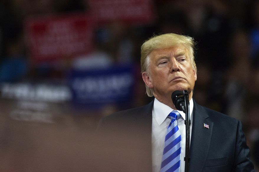 President Donald Trump takes the stage at a rally in support of the Senate candidacy of West Virginia's Attorney General Patrick Morrisey, Tuesday, Aug. 21, 2018, at the Charleston Civic Center in Charleston, W.Va. (Craig Hudson/Charleston Gazette-Mail via AP)