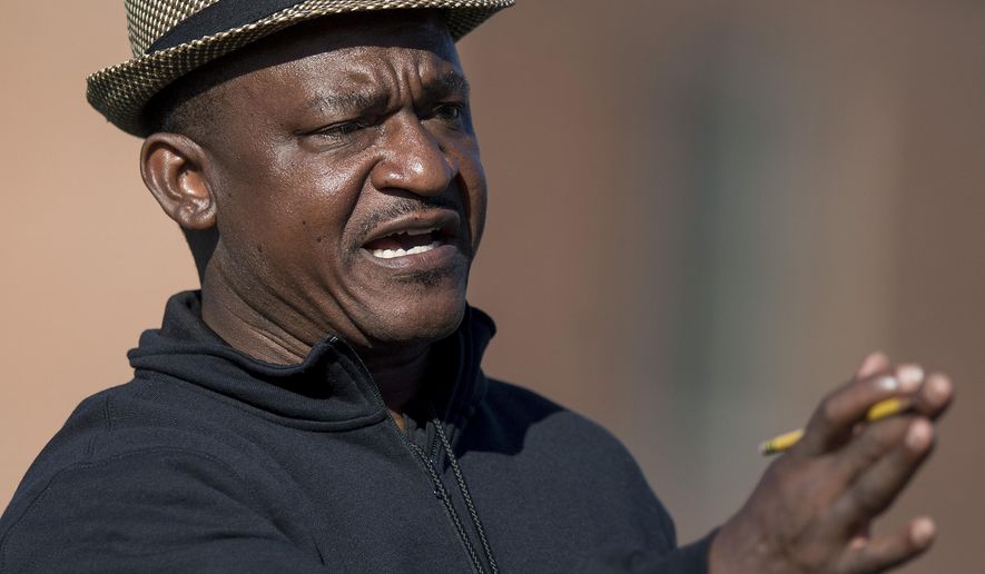 Alabama State University head football coach Donald Hill-Eley coaches during spring practice on the ASU campus in Montgomery, Ala., Wednesday April 4, 2018. Hill-Eley didn't just listen to his players when they pointed to the challenges of juggling academics and football amid Morgan State’s struggles with the NCAA’s Academic Progress rate. He joined them, and hopes to complete his doctorate after his first full season as Alabama State's head man. (Mickey Welsh/The Montgomery Advertiser via AP)