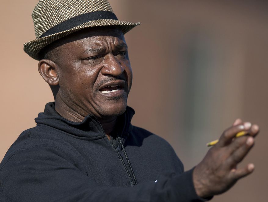 Alabama State University head football coach Donald Hill-Eley coaches during spring practice on the ASU campus in Montgomery, Ala., Wednesday April 4, 2018. Hill-Eley didn't just listen to his players when they pointed to the challenges of juggling academics and football amid Morgan State’s struggles with the NCAA’s Academic Progress rate. He joined them, and hopes to complete his doctorate after his first full season as Alabama State's head man. (Mickey Welsh/The Montgomery Advertiser via AP)