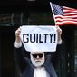 Protester Bill Christeson holds up a sign saying &amp;quot;guilty&amp;quot; as the first count of guilty comes in at he trial of former Donald Trump campaign chairman Paul Manafort, at federal court in Alexandria, Va., Tuesday, Aug. 21, 2018. (AP Photo/Jacquelyn Martin)