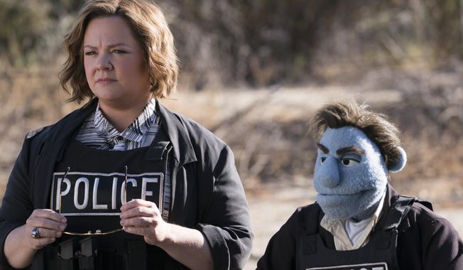 This image released by STX Entertainment shows Melissa McCarthy in a scene from "The Happytime Murders." (Hopper Stone/STX Entertainment via AP)