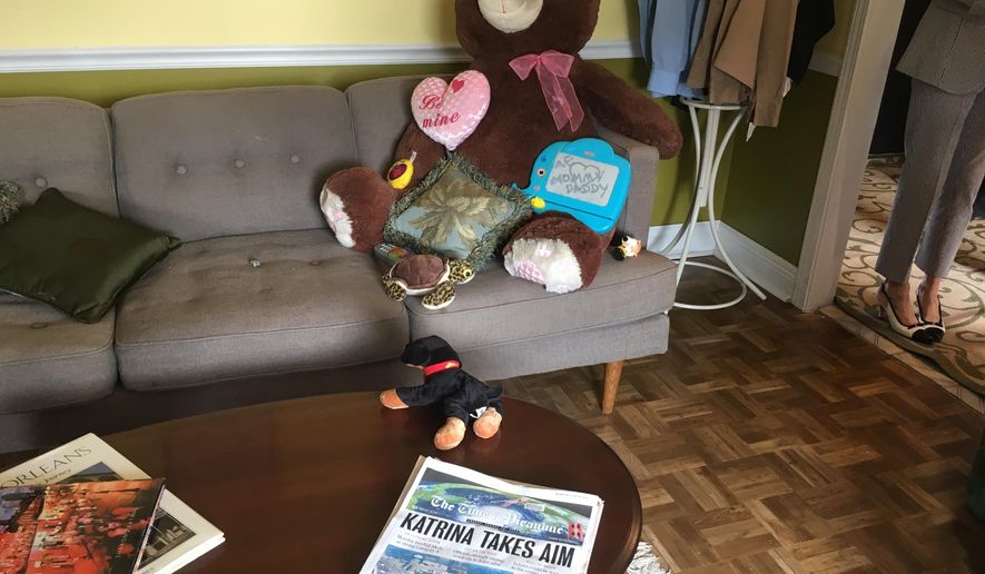 A front page of "The Times-Picayune" newspaper from Aug. 28, 2005, is shown on a coffee table in a house near New Orleans' London Avenue Canal, one of the places where levee breached during Hurricane Katrina, which struck a day later, inundated the city. The organization Levees.org purchased the gutted house and had the rooms restored to resemble a typical home the day before the storm. (AP Photo/Kevin McGill)