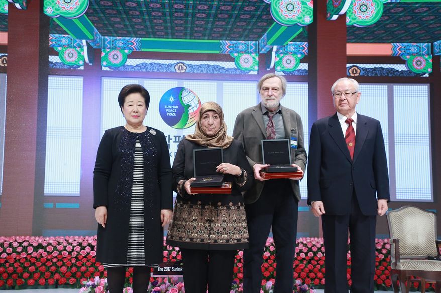 Dr. Moon stands with the 2017 recipients of the Sunhak Peace Prize. Dr. Sakena Yacoobi, (left) and Dr. Gino Strada, second right. Dr. Hong Il-sik, stands at the far right. (PHOTO CREDIT: HSA-UWC)