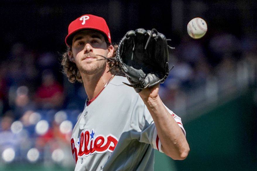 Philadelphia Phillies starting pitcher Aaron Nola walks back to the mound during a baseball game against the Washington Nationals at Nationals Park Thursday, Aug. 23, 2018, in Washington. The Phillies won 2-0. (AP Photo/Andrew Harnik)