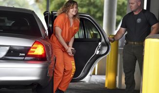Reality Winner arrives at a courthouse in Augusta, Ga., Thursday, Aug. 23, 2018, after she pleaded guilty in June to copying a classified U.S. report and mailing it to an unidentified news organization. (Michael Holahan/The Augusta Chronicle via AP)