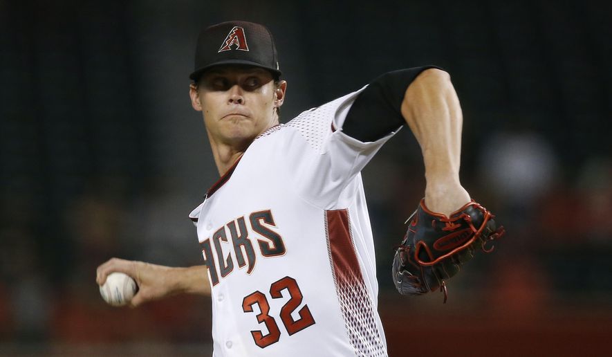 Arizona Diamondbacks starter Clay Buchholz throws a pitch to a  Los Angeles Angels batter during the first inning of a baseball game Wednesday, Aug. 22, 2018, in Phoenix. (AP Photo/Ross D. Franklin)