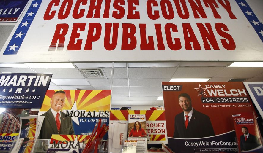 In this Aug. 6, 2018, photo, Campaign information for all the Republican candidates for the 2nd Congressional District are set up at a Republican party event in Sierra Vista, Ariz. Arizona's 2nd Congressional District is a primary battle as seven Democrats and four Republicans seek to succeed Republican Rep. Martha McSally, who is for a U.S. Senate seat. (AP Photo/Ross D. Franklin)