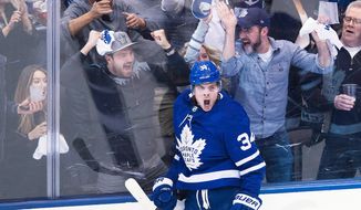FILE - In this April 16, 2018, file photo, Toronto Maple Leafs center Auston Matthews (34) reacts after scoring against the Boston Bruins during second period NHL, round one playoff hockey game in Toronto. When the Arizona Coyotes moved to the desert in 1996, the youth hockey scene in the desert was nearly non-existent. With the help of the Coyotes and a big boost from Auston Matthews&#39; popularity, Arizona has become one of the fastest-growing areas for grassroots hockey. (Nathan Denette/The Canadian Press via AP, File)