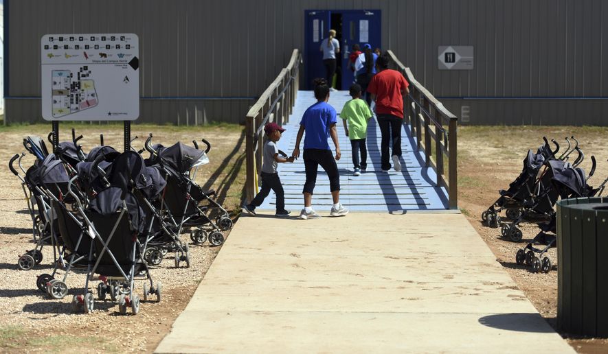 In this Aug. 9, 2018, photo, provided by U.S. Immigration and Customs Enforcement, immigrants walk into a building at South Texas Family Residential Center in Dilley, Texas. A complaint expected to be filed Thursday, Aug. 23 with the Department of Homeland Security alleges that immigration authorities coerced dozens of parents separated from their children at the border to sign documents they didn&#39;t understand. In some of those cases, parents gave away rights to be reunited with their kids. The complaint will be filed by the American Immigration Lawyers Association and the American Immigration Council. (Charles Reed/U.S. Immigration and Customs Enforcement via AP) **FILE**