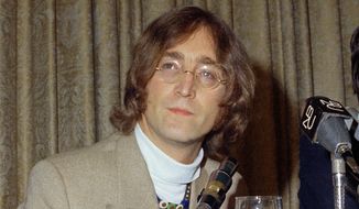 In this 1971 file photo, singer John Lennon appears during a press conference. (AP Photo, File)