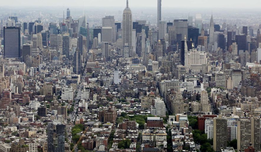 FILE- In this May 20, 2015 file photo, Midtown Manhattan, including the Empire State Building, center, are seen from the observatory at One World Trade Center in New York. The Trump administration announced new rules Thursday, Aug. 23, 2018, aimed at preventing residents in high-tax states from avoiding a new cap on widely popular state and local tax deductions. (AP Photo/Mark Lennihan, File)