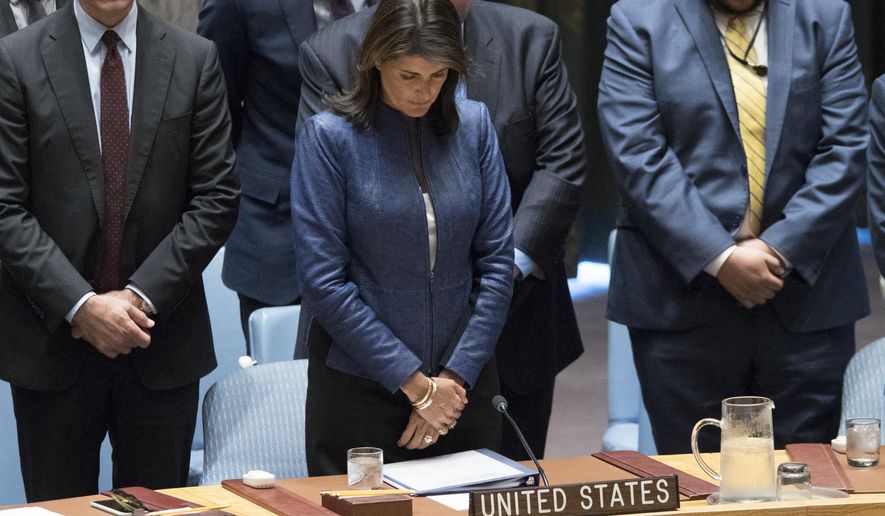 American Ambassador to the United Nations Nikki Haley observes a moment of silence in honor of former Secretary-General Kofi Annan before a Security Council meeting on threats to international peace and security caused by terrorist acts, Thursday, Aug. 23, 2018 at United Nations headquarters. (AP Photo/Mary Altaffer)