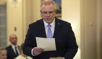 Incoming Australian Prime Minister Scott Morrison is sworn in at Government House, Canberra, Friday, Aug. 24, 2018. Australia government lawmakers on Friday elected Treasurer Morrison as the next prime minister in a ballot that continues an era of extraordinary political instability. (AP Photo/Andrew Taylor)