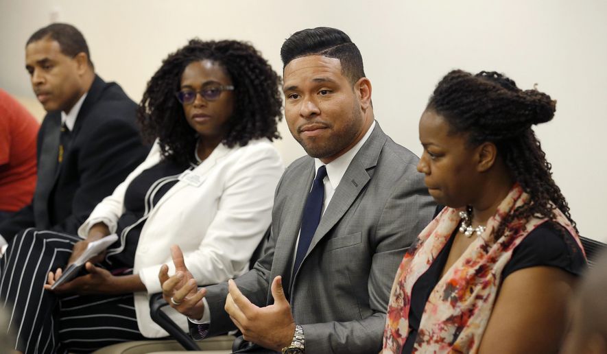 Devin Del Palacio, second from right, a Democrat running for the Arizona House of Representatives, speaks during an African-American candidates forum along with Democrat mayoral candidate Tim Seay, left, Justice of the Peace candidate Sharon Sauls, second from left, and Democrat candidate for Arizona Corporation Commission Kiana Maria Sears, right, Wednesday, Aug. 8, 2018, in Phoenix. They join at least 30 African-Americans running for local, state and federal office in Arizona this year. (AP Photo/Ross D. Franklin)
