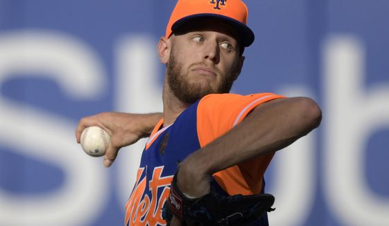 New York Mets pitcher Zack Wheeler delivers the ball to the Washington Nationals during the fourth inning of a baseball game Saturday, Aug. 25, 2018 in New York. (AP Photo/Bill Kostroun)