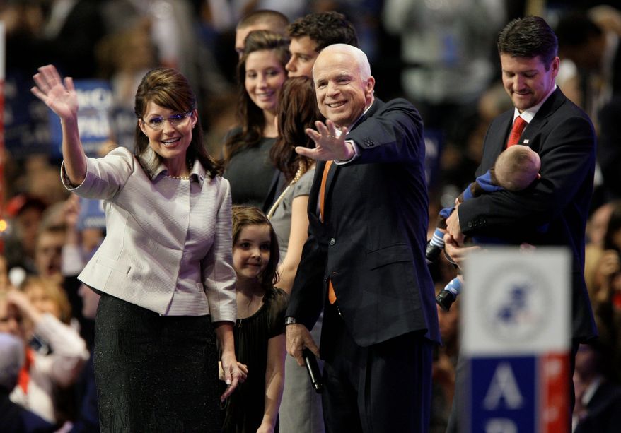 FILE - In this Sept. 3, 2008, file photo, Republican presidential candidate John McCain, center, joins vice presidential candidate Sarah Palin, left, and her family following her speech at the Republican National Convention in St. Paul, Minn. Aide says senator, war hero and GOP presidential candidate McCain died Saturday, Aug. 25, 2018. He was 81. (AP Photo/Charlie Neibergall, File)