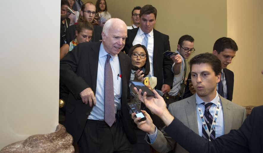 FILE - In this July 28, 2017, file photo, Sen. John McCain, R-Az., front left, is is followed by reporters after casting a &#39;no&#39; vote on a a measure to repeal parts of former President Barack Obama&#39;s health care law, on Capitol Hill in Washington. Longtime friends and advisers of Sen. John McCain say they’re not surprised by his decision in September to oppose a last-ditch Republican effort to overhaul the nation’s health care law. McCain objected to the legislation in part because Senate GOP leaders wanted a vote without holding hearings or debate. (AP Photo/Cliff Owen, File)