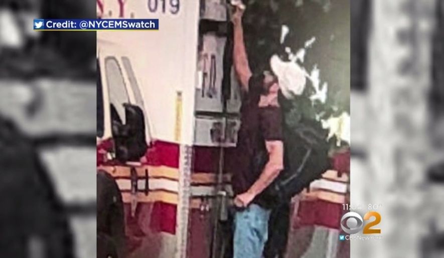 The New York City Fire Department is looking for information on a man who was caught on camera writing NAZI pigs” and swastikas on multiple FDNY ambulances, Aug. 26, 2018. (Image: CBS New York screenshot)
