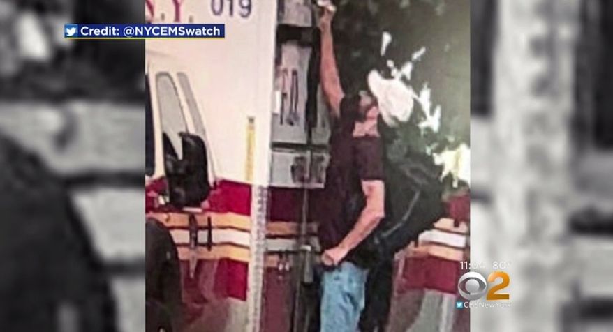 The New York City Fire Department is looking for information on a man who was caught on camera writing NAZI pigs” and swastikas on multiple FDNY ambulances, Aug. 26, 2018. (Image: CBS New York screenshot)