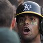FILE - In this Aug. 11, 2018, file photo, Oakland Athletics&#39; Khris Davis, right, is congratulated by Matt Chapman after hitting a solo home run during the third inning of a baseball game against the Los Angeles Angels in Anaheim, Calif. Davis has certainly contemplated the idea of hitting 50 home runs. The Oakland slugger knows it is right within reach at the pace he is on after two straight 40-homer years in his first two seasons with the Athletics. (AP Photo/Mark J. Terrill, File)