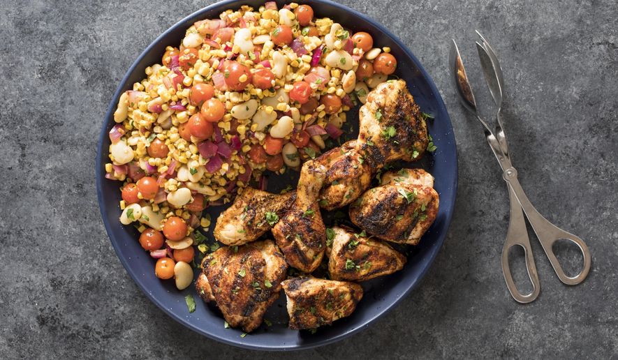 This undated photo provided by America's Test Kitchen in August 2018 shows paprika- and lime-rubbed grilled chicken in Brookline, Mass. This recipe appears in the cookbook “Dinner Illustrated.” (Daniel J. van Ackere/America's Test Kitchen via AP)