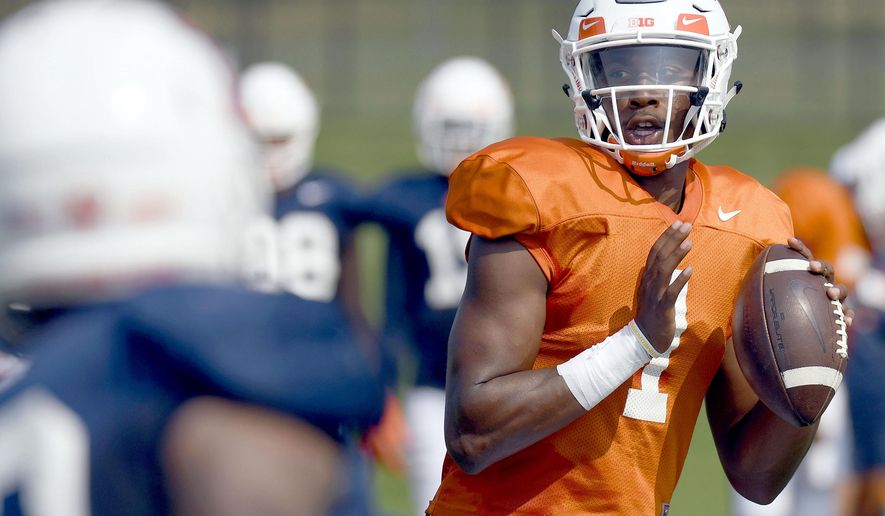 FILE - In this Aug. 14, 2018, file photo, Illinois quarterback AJ Bush (1) throws during NCAA college football training camp in Urbana, Ill.  After an intensive three-man competition, and less than a week before the season opener at home against Kent State, Illinois coach Lovie Smith has picked senior transfer AJ Bush as his starting quarterback. Bush beat out last year&#39;s starter and a promising three-star freshman recruit. (Stephen Haas/The News-Gazette via AP, File)