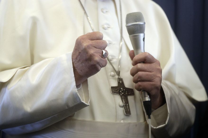 Pope Francis gestures as he answers to a journalist&#39;s question during a press conference aboard of the flight to Rome at the end of his two-day visit to Ireland, Sunday, Aug. 26, 2018. (AP Photo/Gregorio Borgia, Pool)
