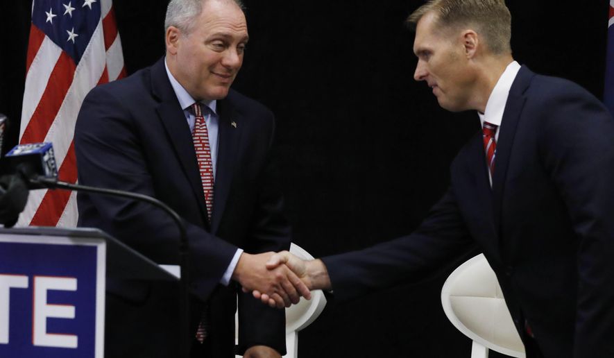 House Majority Whip U.S. Rep. Steve Scalise, R-La., left, shakes hands with Mike Guest, Republican nominee for the state's Third Congressional District race, during a press availability in Jackson, Miss., Monday, Aug. 27, 2018. Scalise was in Mississippi to headline a luncheon to benefit the Mississippi Republican Party's United Republican Fund.(AP Photo/Rogelio V. Solis)